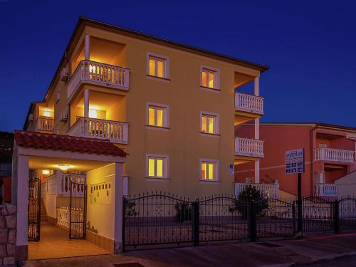 a large apartment building with its lights on at Beautiful Apartment in Dramalj in Dramalj