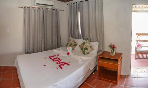 Ein Bett oder Betten in einem Zimmer der Unterkunft Pousada Jerimar