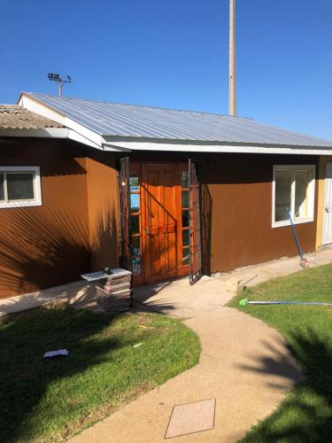 a house being constructed with the door open at Cabañas Costatour Quintero in Quintero