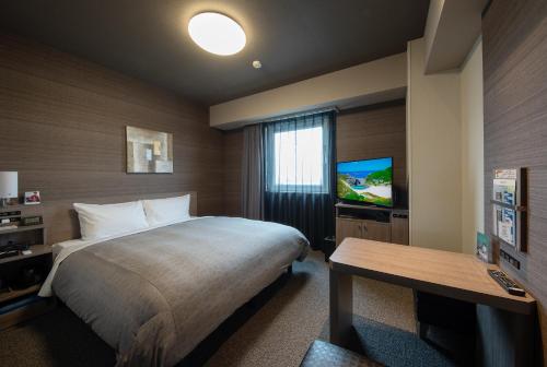 Postel nebo postele na pokoji v ubytování Hotel Route-Inn Ichihara