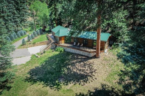 an overhead view of a log cabin with a green roof at Colorado Bear Creek Cabins in Evergreen