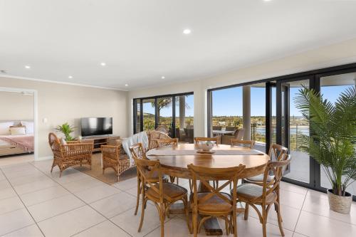 a living room with a table and chairs at Shawhaven in East Ballina