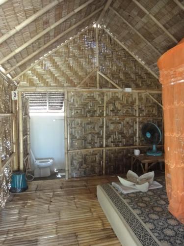 a room with a bathroom with a toilet in it at Varin Village Koh Lipe in Ko Lipe