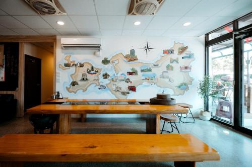 a wall with a mural of a map on it at 金鷺民宿 in Jincheng