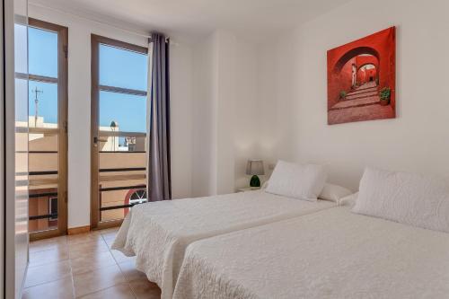 Posteľ alebo postele v izbe v ubytovaní Apartamento Pizarro 2b
