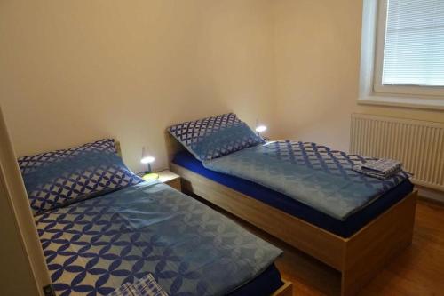 Postel nebo postele na pokoji v ubytování Apartmán Borůvka