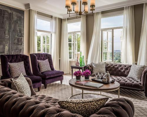 a living room with a couch and a table at Four Seasons Hotel The Westcliff in Johannesburg