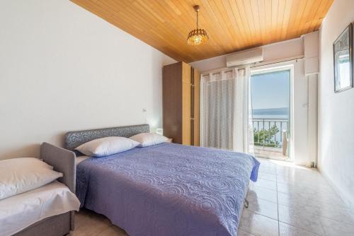 Posteľ alebo postele v izbe v ubytovaní Apartments Kod Cara