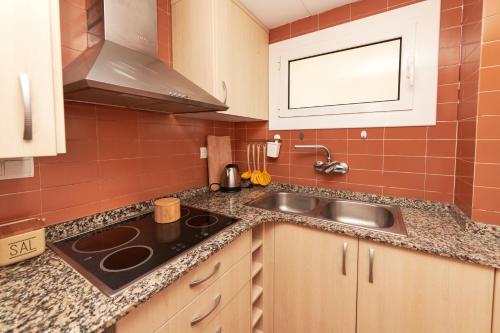 a kitchen with a sink and a counter top at Desconnectar Tossa de Mar in Tossa de Mar