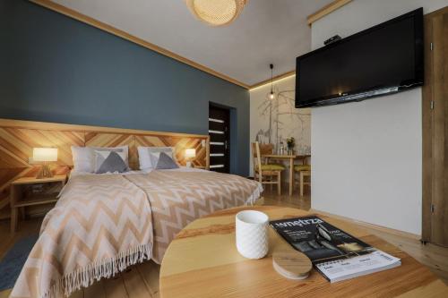 Katil atau katil-katil dalam bilik di Biała izba Apartamenty