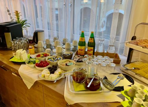 a table with a bunch of food and drinks on it at Gasthof 'Zum alten Turm' in Haslach an der Mühl