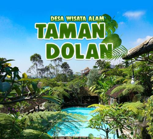 Taman Dolan Home & Resort في باتو: علامة مكتوب عليها دولارات التمرين في منتجع استوائي