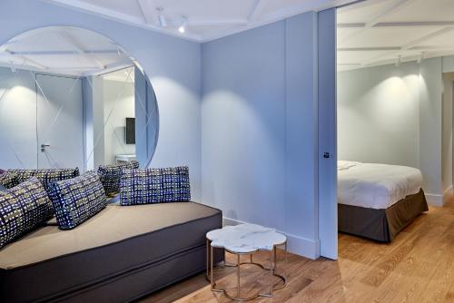 a bedroom with a bed and a mirror at Jugend- und Familienhotel Augustin in Munich