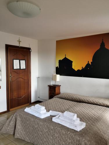 Postel nebo postele na pokoji v ubytování Domus Getsemani
