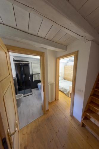 a view of a room with a bedroom and a bed at Casa Patrone in Nebbiuno