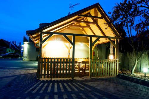 a small pavilion with a table in a building at Apartmán Lenka in Veľký Meder