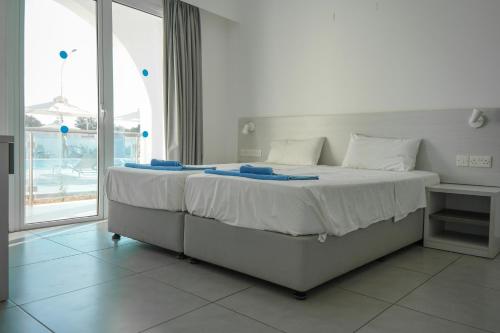 Ένα ή περισσότερα κρεβάτια σε δωμάτιο στο Kaos Hotel Apartments