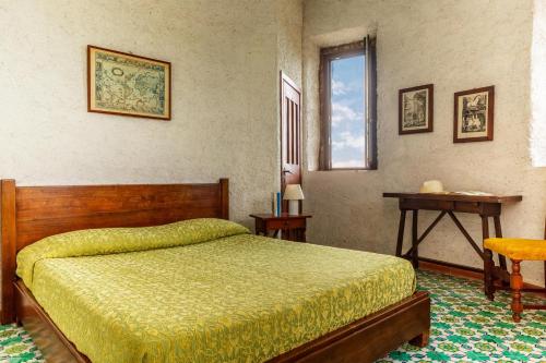 A bed or beds in a room at Torre Rivolta