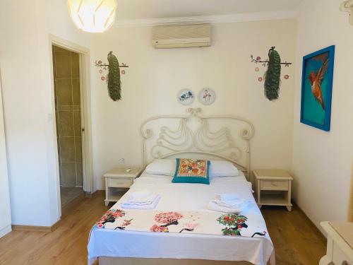 Ліжко або ліжка в номері Bodrum Sade Pension