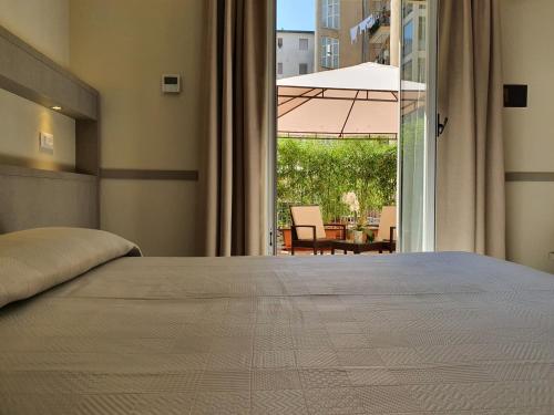 Postel nebo postele na pokoji v ubytování Hotel Corallo
