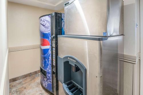 a refrigerator with its door open in a room at Quality Inn & Suites Downtown Walla Walla in Walla Walla