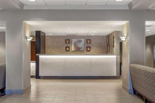 a lobby with a reception desk in a building at Comfort Inn Kearney I-80 in Kearney