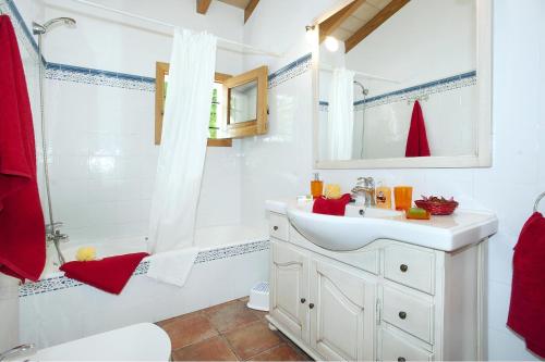 a bathroom with a white sink and a shower at Villa BURGUES in Alcudia