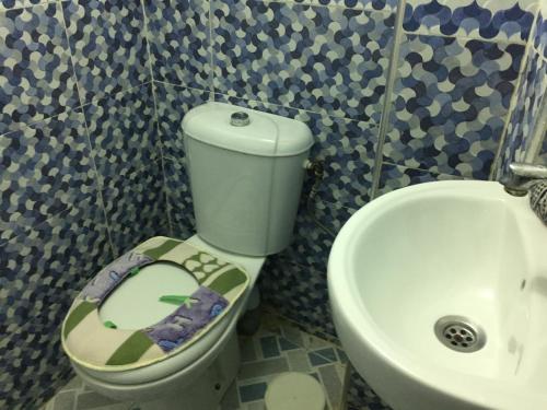 a bathroom with a toilet and a sink at Family Room for 6 peoples Sunny Riad Inside Medina Fes El Bali in Fez