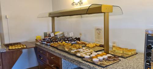 a buffet of food and drinks on a counter at Parador de Gredos in Navarredonda de Gredos