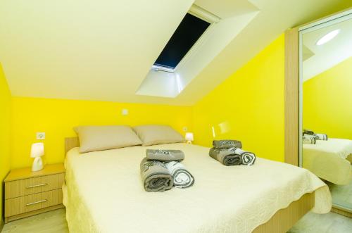 Katil atau katil-katil dalam bilik di Apartments Donita