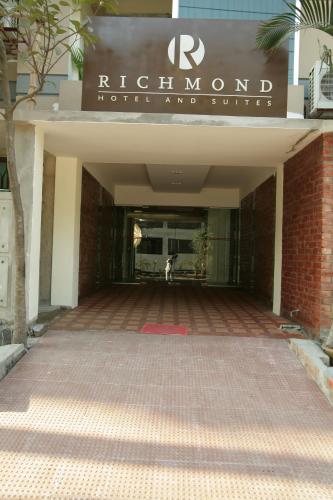 a building with a sign that reads richmond house and service at Richmond Hotel & Suites in Dhaka