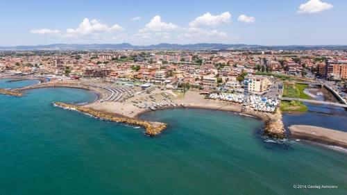 an aerial view of a beach with a city at Rosso Tramonto luxury-white- LADISPOLI, Lungomare Regina Elena 58 in Ladispoli