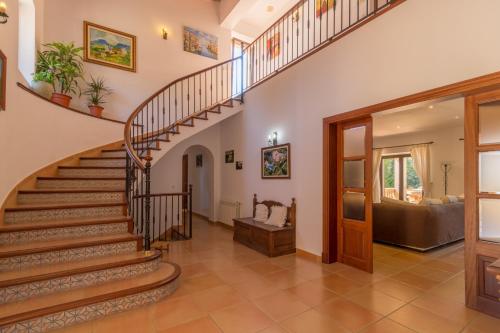 a spiral staircase in a home with a living room at Felanitx - 3029-85 Mallorca in Felanitx