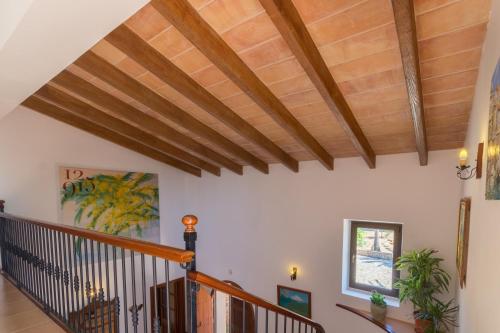a hallway with wooden ceilings and wooden beams at Felanitx - 3029-85 Mallorca in Felanitx
