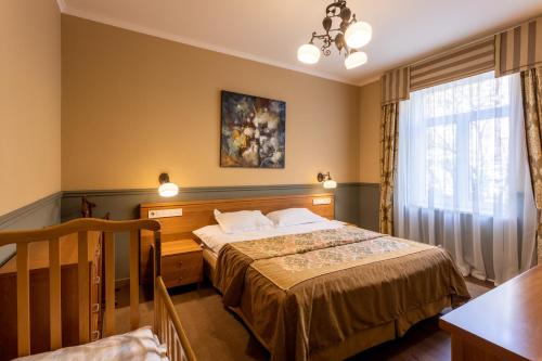 Cama ou camas em um quarto em Frapolli Hotel