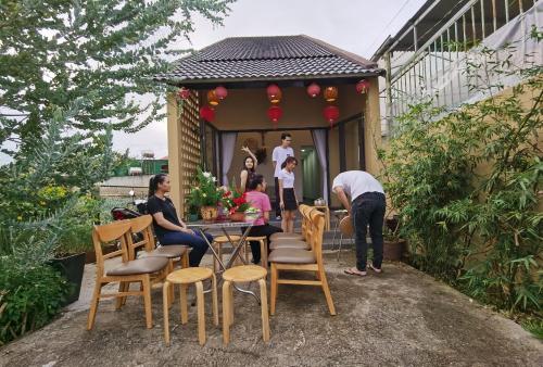 a group of people sitting at a table on a patio at DaLaHa City in Da Lat