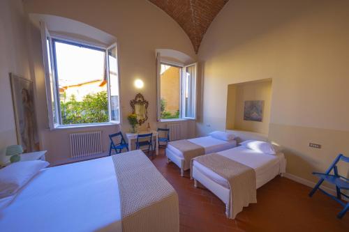 Katil atau katil-katil dalam bilik di Bergamo Bella B&B