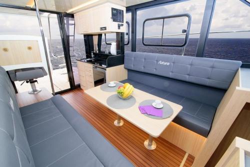 a view of the inside of a boat with a table at Jacht motorowy Futura 40 FLY Grand Horizon in Wilkasy