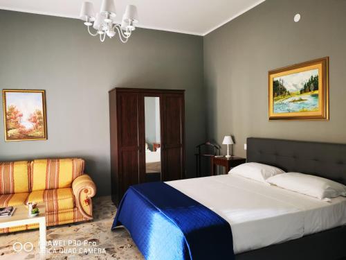 Postel nebo postele na pokoji v ubytování L'ARENA ROOM