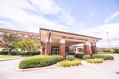 a building with a sign that reads the marks r marian inn at James F. Martin Inn in Clemson