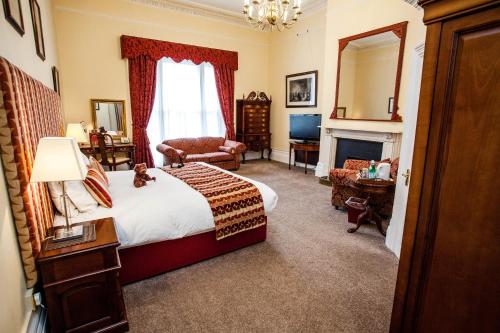 Ένα ή περισσότερα κρεβάτια σε δωμάτιο στο Clarence Court Hotel
