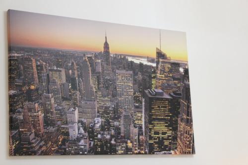 a view of the empire state building from the top of the building at Luxury City Center Apartment - Bucharest Railways Station in Bucharest