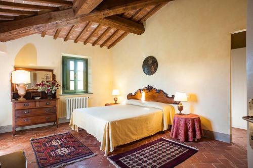 Tenuta di Ghizzano Resort tesisinde bir odada yatak veya yataklar