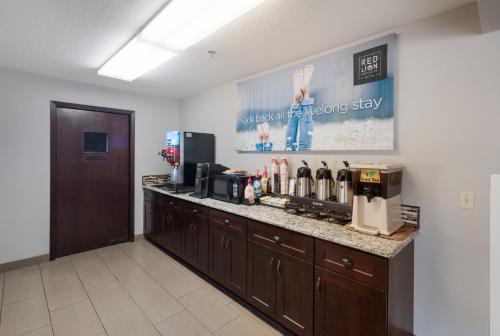 a room with a counter with a coffee station at Quality Inn & Suites Kennewick Tri-Cities in Kennewick