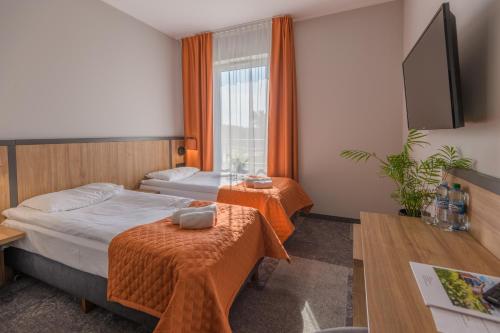 Ліжко або ліжка в номері Hotel Węgierki