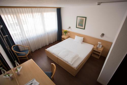 Кровать или кровати в номере Hotel Metropol