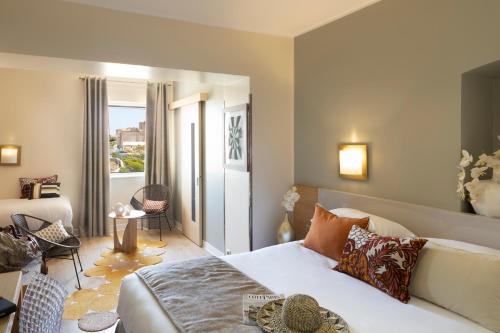 a bedroom with a bed and a living room at Santateresa in Bonifacio