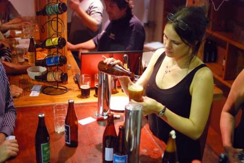 a woman standing at a bar with a drink at Sancta Maria 10 - Ultimate in luxury & majestic sea views includes private entertainment deck - Free wifi in Kingsburgh