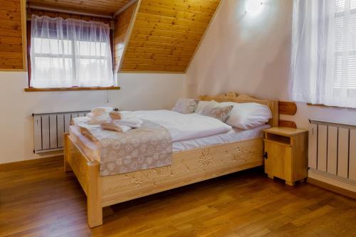 Postel nebo postele na pokoji v ubytování TatryHome