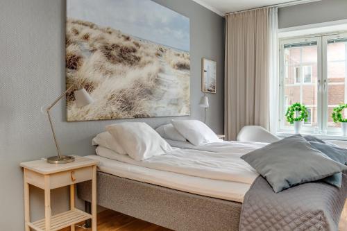 Postel nebo postele na pokoji v ubytování Ludvika Stadshotell